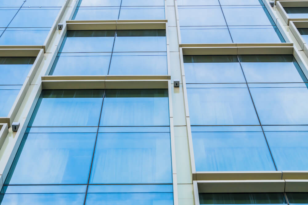 Facade curtain wall menggunakan kaca stopsol